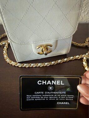 Chanel mini flap with a pearl top handle